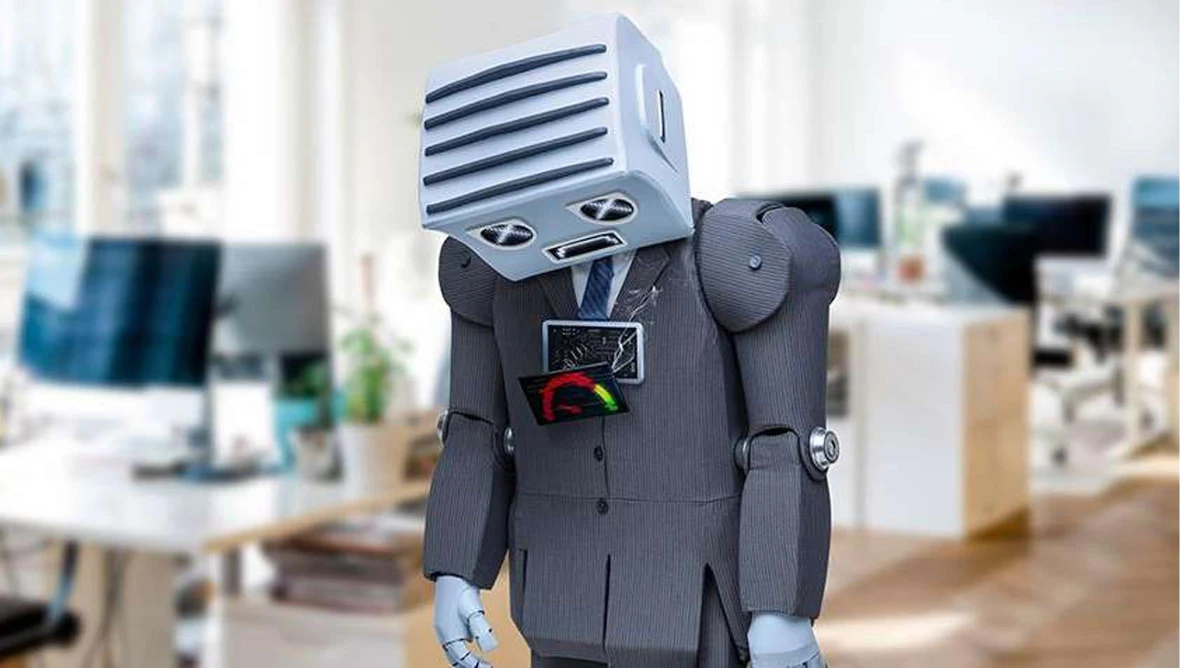 Humanoider Roboter im Anzug steht im Büro mit gesenktem Kopf und wirkt erschöpft.
