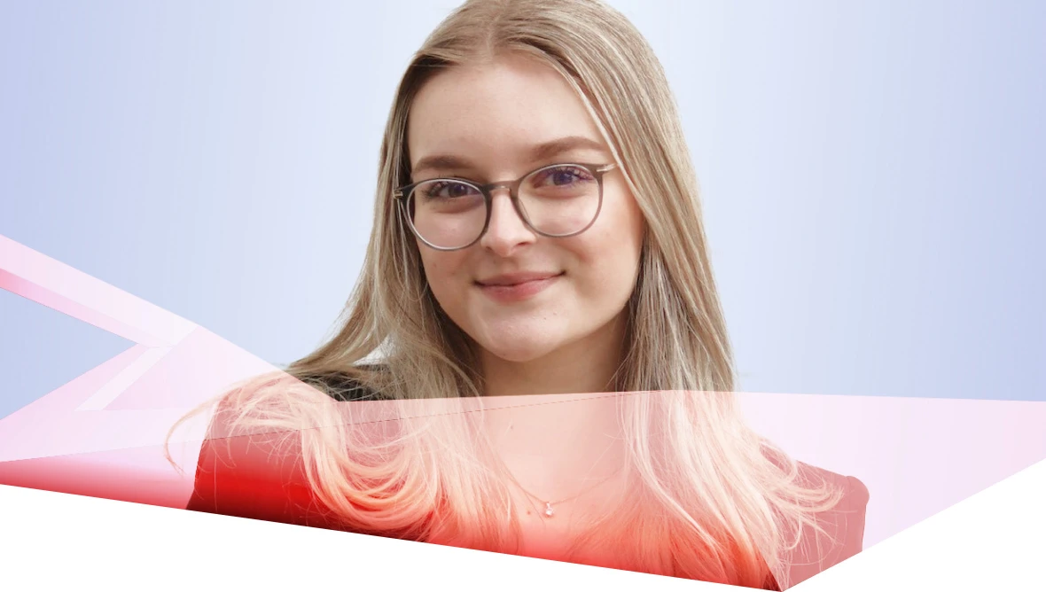Person with long hair and glasses in front of a light blue background with pink shapes.